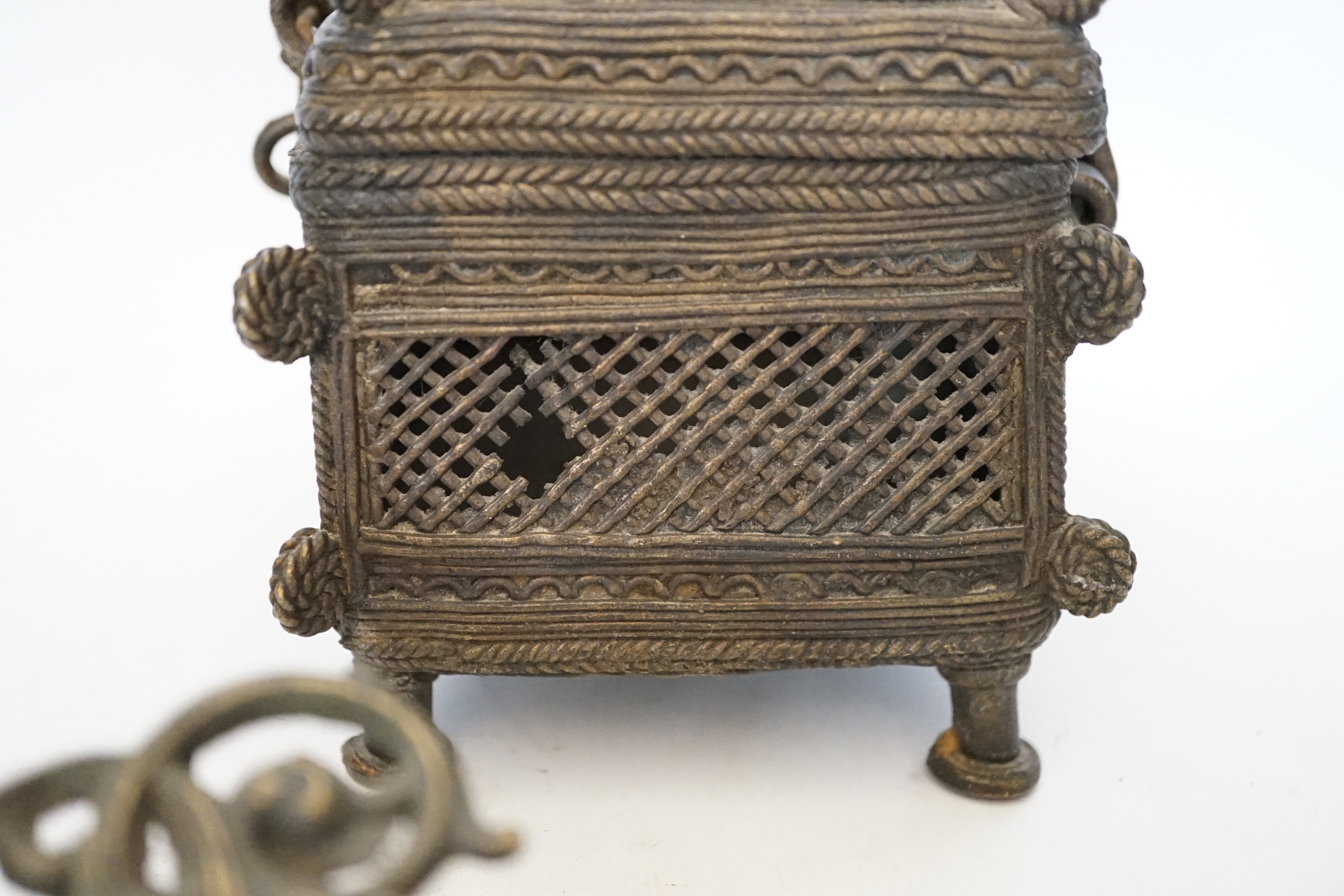 An African Benin style bronze casket and pair of wall sconces, 22cm